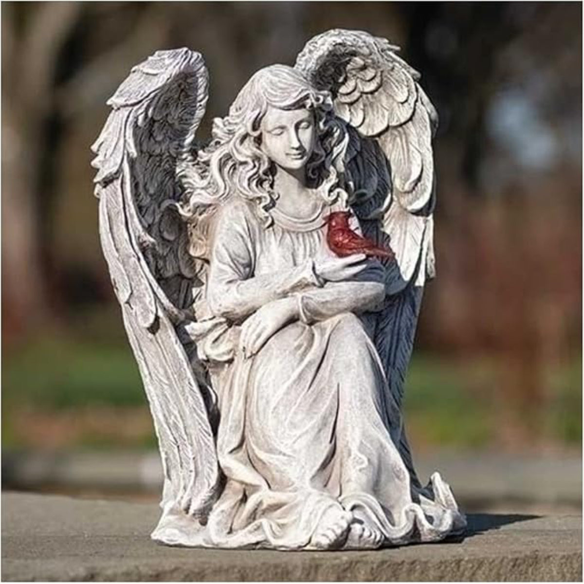 Angel with Cardinal Statue